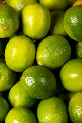 Lime lemon. Close-up pile of lemons. Food background
