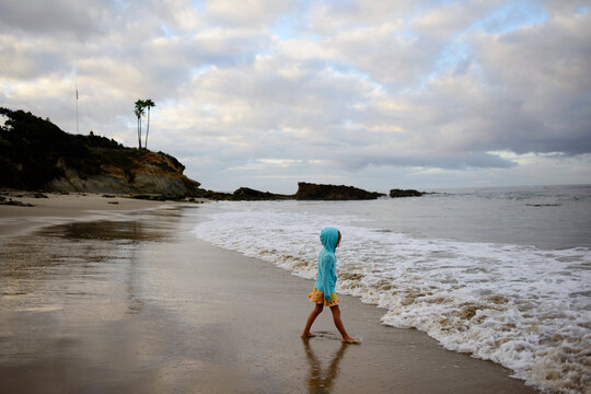 Side view of girl standing at Laguna Beach