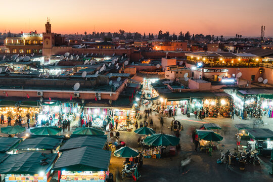 High angle view of people shopping at Marrakesh market during night in city