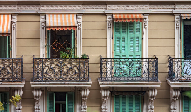 Traditional ornate building facade with wooden shutters in Monte Carlo, Monaco