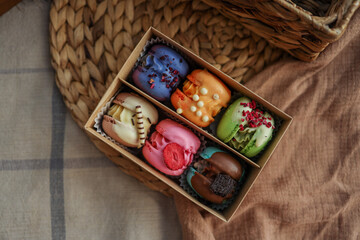 Box of macaroons with different assortment top view in a homely atmosphere