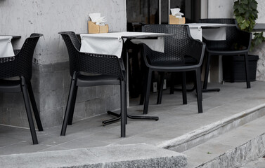 chairs and tables of an outdoor cafe.