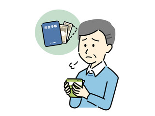 受け取った年金額を確認してため息をするシニア男性