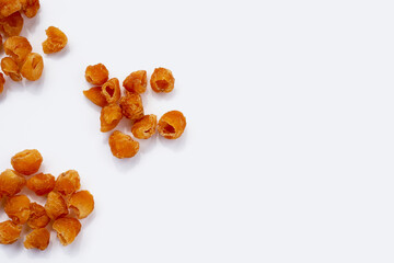 Dried longan on white background.