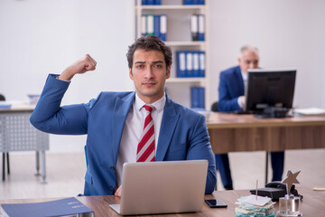 Two male colleagues in employee of the month concept