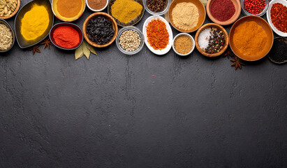 Various spices in bowls on stone table - obrazy, fototapety, plakaty
