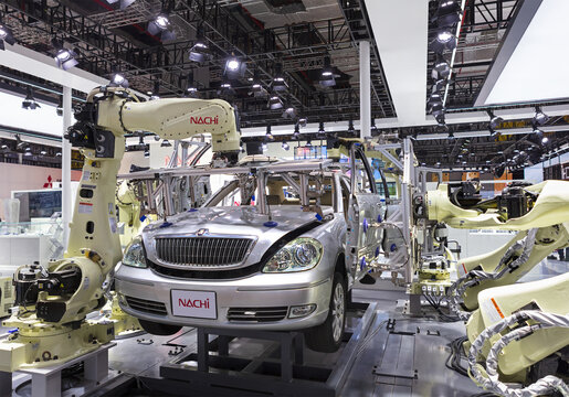 SHANGHAI, CHINA- NOV.6, 2022: Nachi Robot arms working on the body of a car are seen during the fifth China International Import Expo (CIIE).