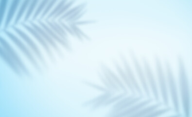 blurry summer background with shadows from palm leaves on a light blue background © Ирина Гутыряк
