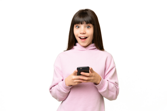 Little girl over isolated green chroma key background surprised and sending a message