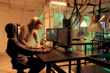 Woman hacker coding computer worm program, hacking internet network system, developing malware....