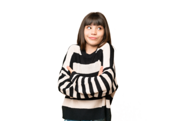 Little girl over isolated green chroma key background making doubts gesture while lifting the shoulders