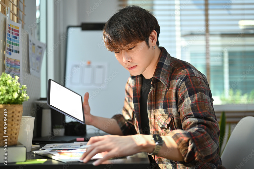 Poster handsome creative man freelancer working on mobile application software design project together at m