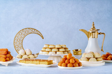 Assorted semolina maamoul or mamoul cookies , awameh or lokma with dallah and ramadan decor...