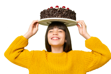 Little girl holding birthday cake over isolated chroma key background