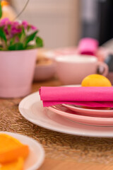 Pink plate with boiled colourful egg
