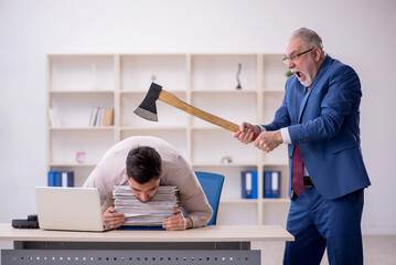 Old male boss and young male employee in bullying concept