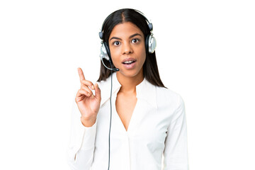 Telemarketer African American woman working with a headset over isolated chroma key background...