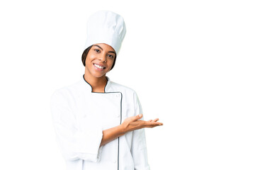 Young African American chef over isolated chroma key background presenting an idea while looking smiling towards - Powered by Adobe