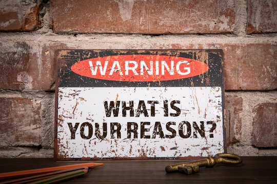 What is your reason. Warning sign with text on wooden shelf