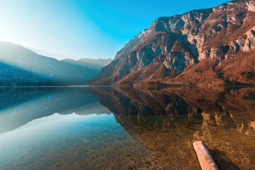 Ukanc, small settlement at western shore of Lake Bohinj in Slovenia surrounded by mountains Vogel and Vogar