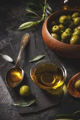 Foto op Plexiglas Green olives with olive oil © Grafvision