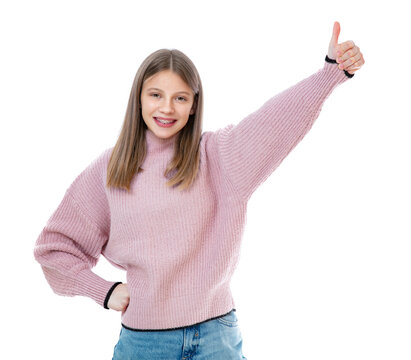 Portrait Of Pretty Girl Showing Thumbs Up Gesture Isolated On White Background. Fourteen Year Old Teenager With Orthodontic Bracket In Pink Sweater Smiling And Posing In Studio.