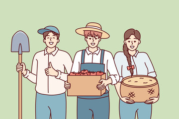 Woman and man dressed as farmers smiling rejoicing at harvest or good sales at organic food agricultural fair. People working in agricultural sector with grown products and shovel in hands 