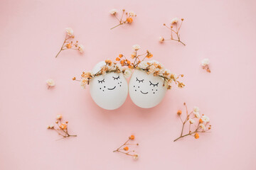 Perfect colorful handmade easter eggs on pink background. The minimal concept. Top view. Card with a copy of the place for the text