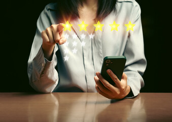 A customer is giving feedback on service quality. She make a choice of the best five star. An image show the performance of business and satisfaction of user. A great advertisement for e-commerce. - 580561893