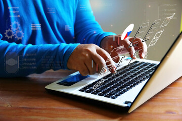 man working on laptop with element futuristic digital technology icon
