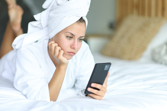 Teen after showering using cell phone