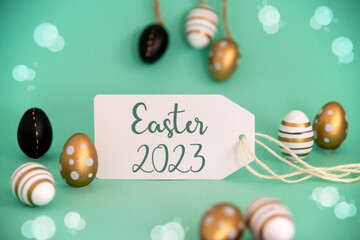 Fototapeta na wymiar Golden Easter Egg Decoration. Label With English Text Easter 2023