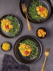 Food photography of salad, salsa, mango, avocado, shrimp, prawn, arugula, rocket, vegetable; onion; sauce, chili