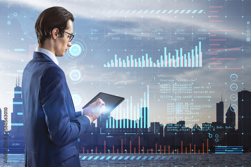 Poster Attractive young european businessman using tablet with glowing digital interface with business charts and coding on blurry city background. Future and cyberspace concept. Double exposure.