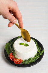 Concept of tasty dairy product - ricotta cheese