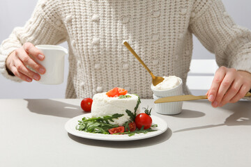 Concept of tasty dairy product - ricotta cheese