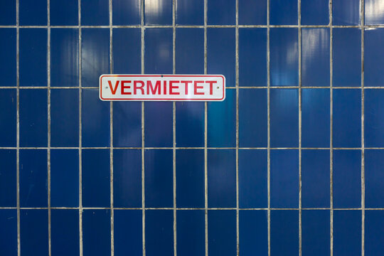 Blue tiled wall in parking lot