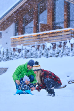 Happy family enjoying in snow