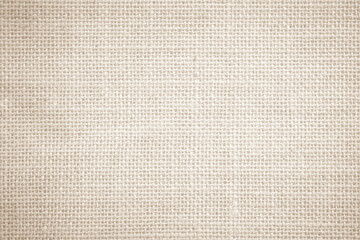 Jute hessian sackcloth burlap canvas woven, linen and cotton texture background pattern in light beige cream brown natural

