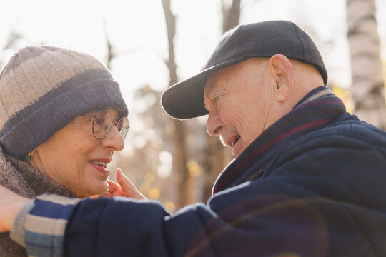 Romantic Senior Couple Face To Face At Park