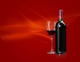 Bottle and glass of tasty red wine.