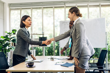 Image two business partner meeting successful handshake together with success join congratulation good deal contract in modern office.Partnership approval and teamwork concept