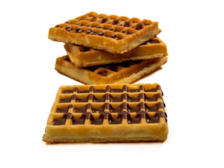 Chocolate waffles isolated on white background. Waffles in chocolate. Close-up.