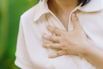 Women experience chest congestion due to suffocation. Health care concept.