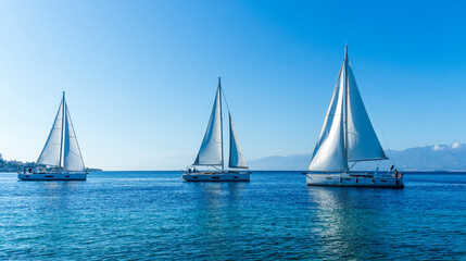 Naklejka premium boats and yachts at the sailing regatta on open water. Sailing on the wind waves in the sea.