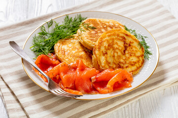 pancakes with sliced cold smoked salmon, top view
