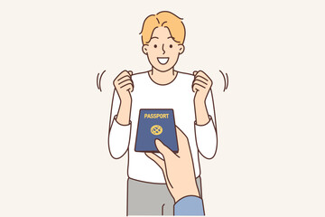Officer give passport to excited man 