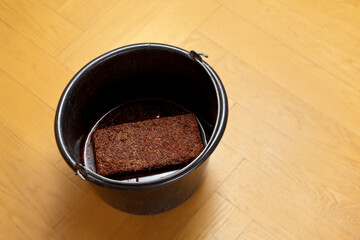 How to make cheap and eco-friendly grow or potting soil from coconut coir, step 3: let soak till all the water is absorbed by the expanding brick.
