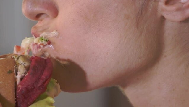 woman eating burger