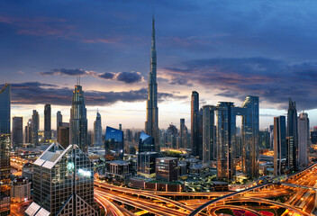 Fototapeta na wymiar Dubai skyline at twilight with traffic - aerial view, United Arab Emirates